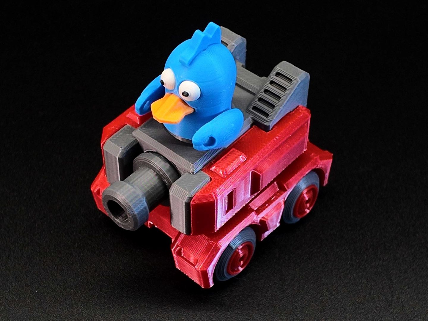 Red armed vehicle with cartoon bird driver